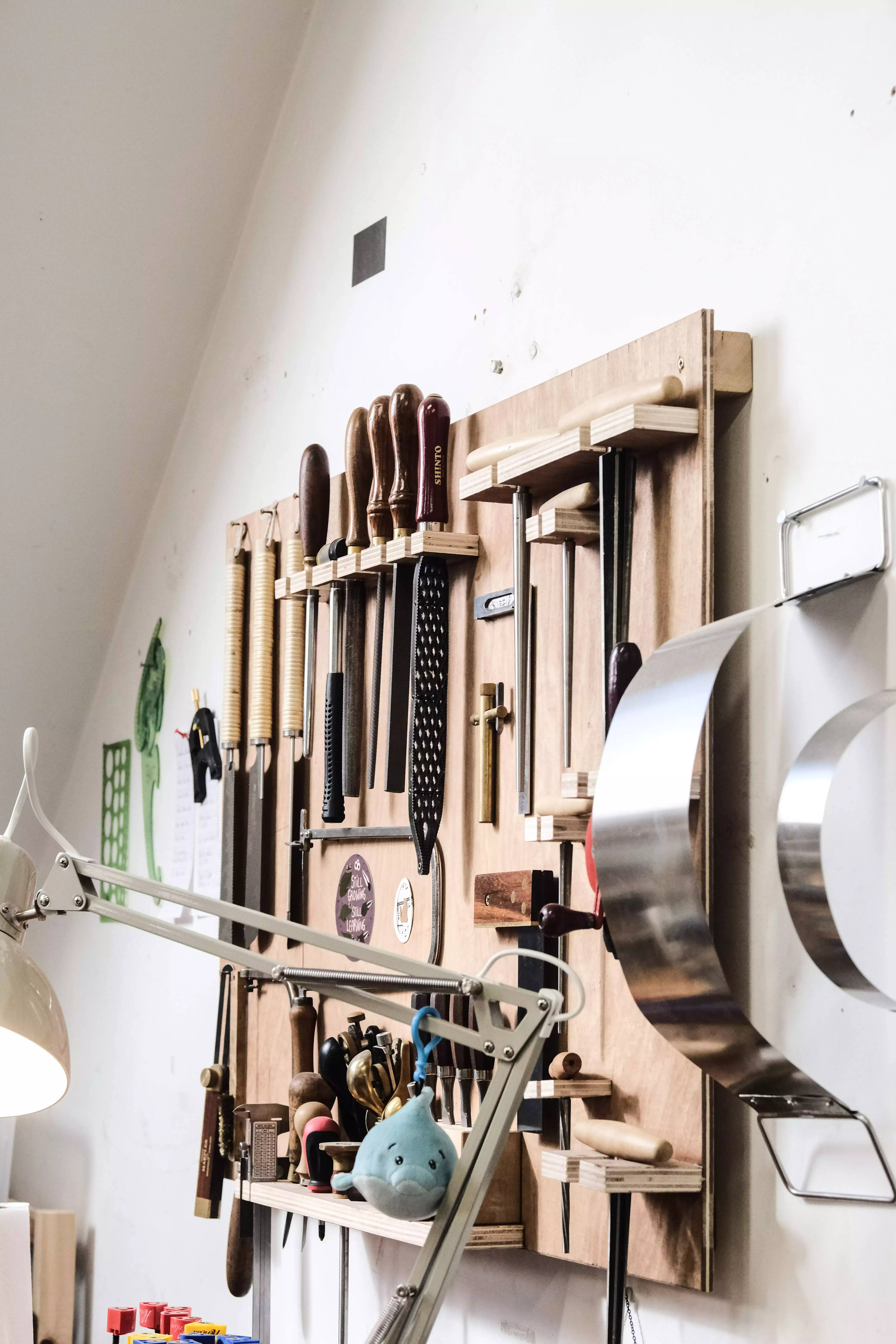 tools hanging on workshop shelf